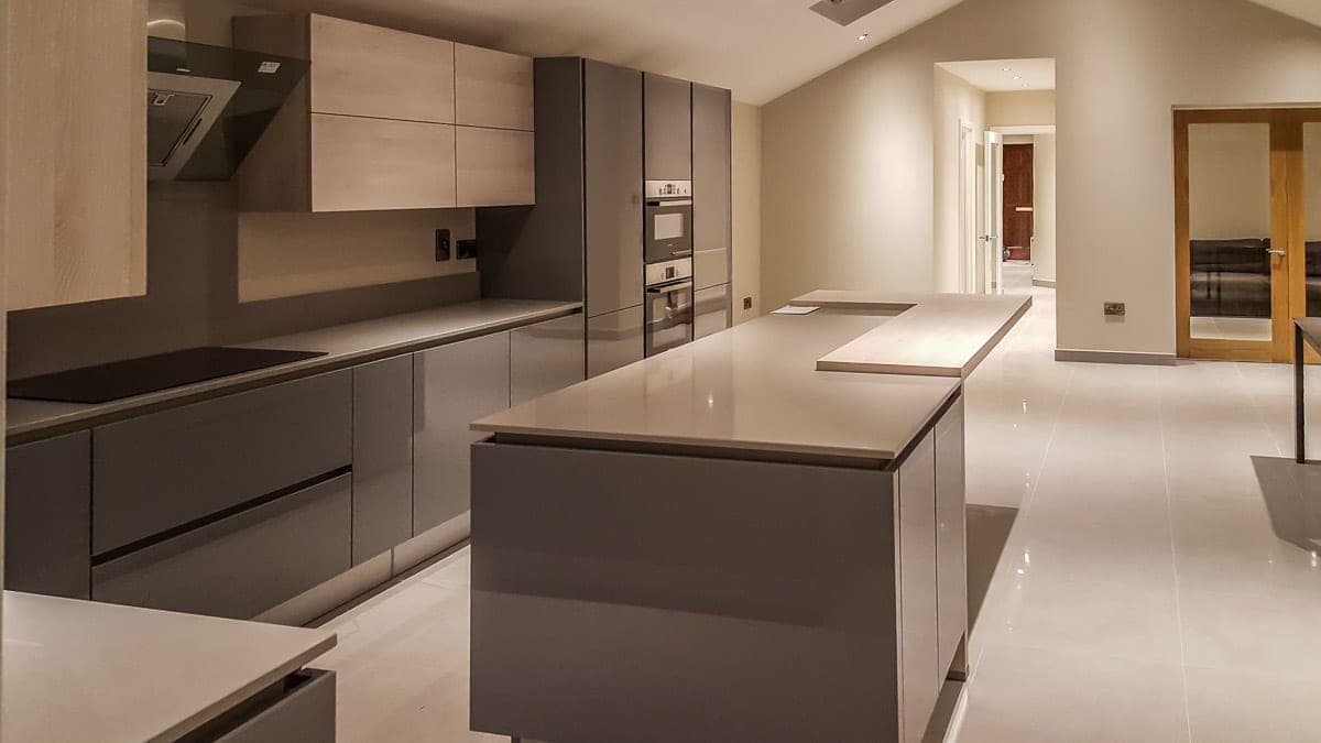 Handleless grey kitchen with a large island