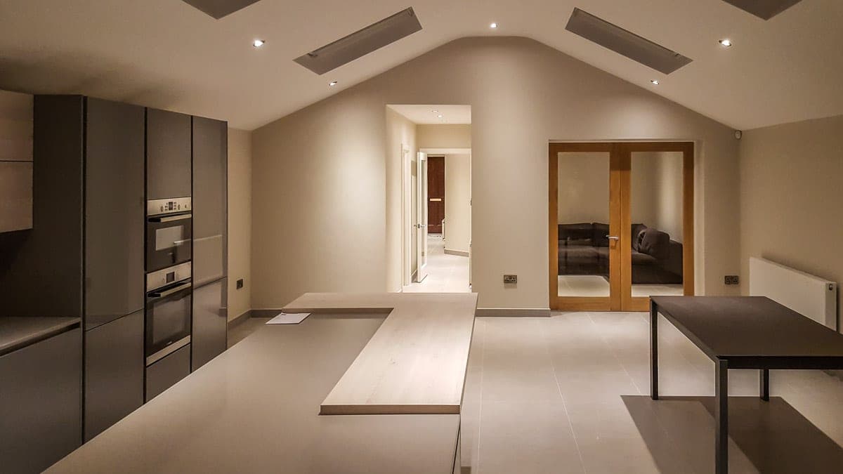 Open-plan space opening through glazed oak double doors