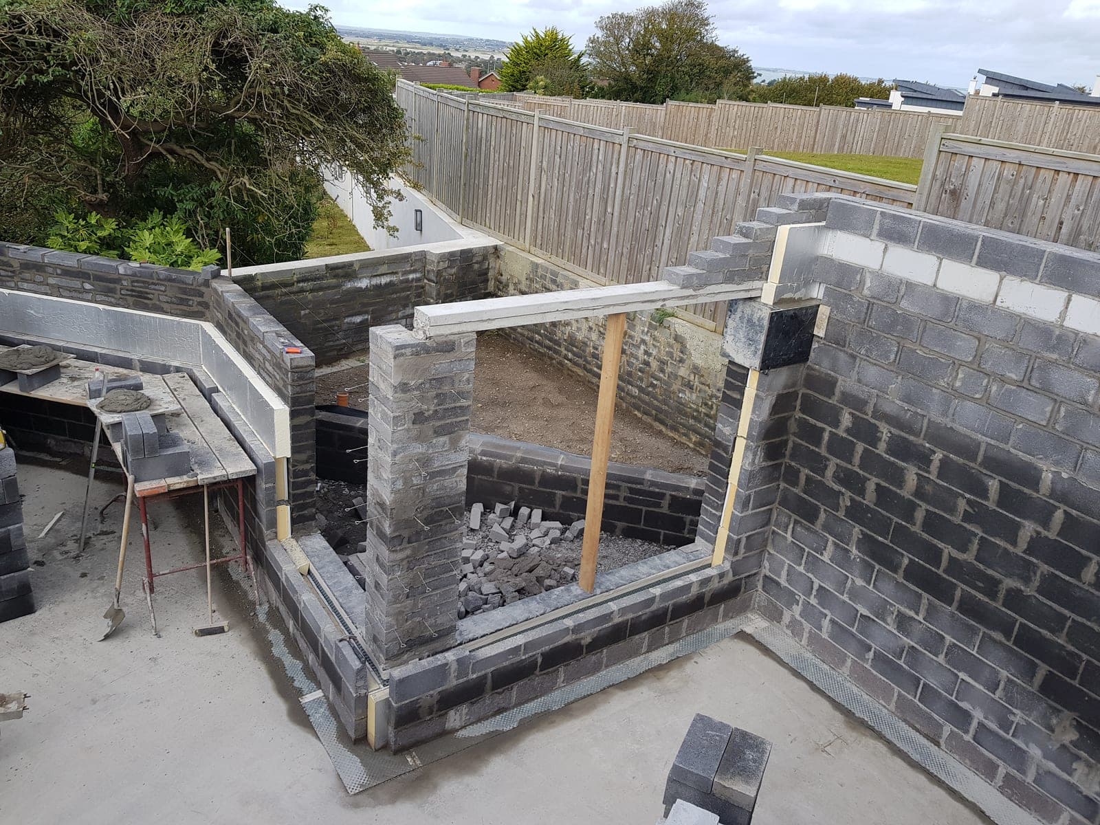 Blockwork walls rising with the window openings formed