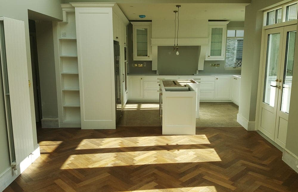 Shaker kitchen and herringbone floor in morning light