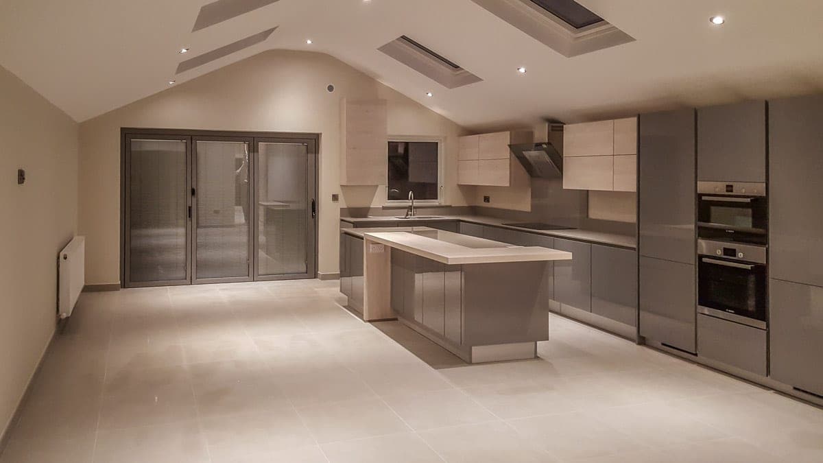Open-plan kitchen and living space with a vaulted ceiling